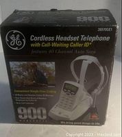 Box showing GE Cordless Headset Telephone model 26970GE1 with call-waiting and caller ID, 40 channel auto scan, and headset image on front.