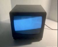 Front view of Ikegami PM-930A 9-inch CRT monitor powered on showing a blue-screen image.