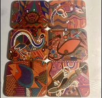 Top view of all six coasters showing colorful Aboriginal animal and dot designs