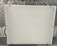 Front view of the vintage Porta-Trace light box showing the smooth translucent white surface for tracing or viewing transparencies.