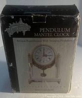 Original box for Universal Studios Monsters Timeless Terror Pendulum Mantel Clock with visible branding and clock image on front.