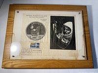 Full view of the framed vintage Apollo 11 Neil Armstrong plaque showing the mission patch, astronaut photo, and stamp