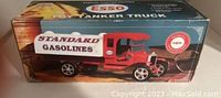 Photo of the original box showing vintage ESSO Toy Tanker Truck artwork and branding with STANDARD GASOLINES text.