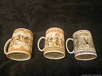 Three Wedgwood steins displayed side by side showing various historical scenes and artwork.