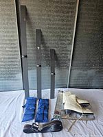 Full lot showing ice skates, blue weighted straps, metal tool branded Tyrol, black frame pieces, and brown belt