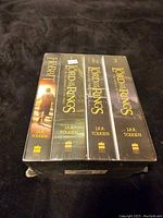 Front view of the box set slipcase containing four books: The Hobbit and three books from The Lord of the Rings series by J.R.R. Tolkien.