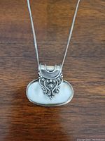 Front view of the sterling silver Mother-Of-Pearl pendant showing detailed Italian silver design and polished Mother-Of-Pearl surface.