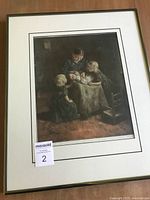 Full view of framed interior scene print showing mother with children and baby on table, image includes wall and floor