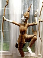 Front view of one dancing Buddha figure showing pose