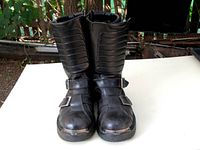 Front view of the pair of black Harley Davidson motorcycle boots showing straps and general shape
