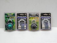 Four new Master Lock padlocks in original packaging, two combination dial locks and two set-your-own combination locks