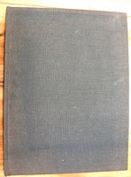 Closed view of the hardcover book showing plain grey cloth binding