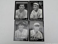 Front of four vintage style black and white baseball cards with player portraits and names showing Morrie Arnovich, Roy Hartzell, Jeep, and Sheriff Blake.