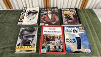 Overview of the collection including books and magazines on James Dean, Michael Jackson, Marilyn Monroe, and others on a green carpet surface