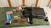 Group photo of vintage electronic items on a green cloth showing all components.