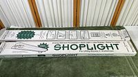 Photo of boxed shop light showing 49 inch length and brand Homevue, suitable for utility rooms and workshops.