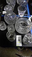 Top view showing decanter and roly poly containers with cut diamond patterns