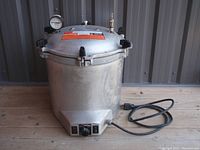 Assembled canner with lid in place and power cord visible