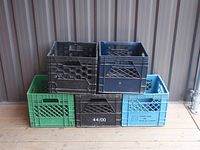 Six milk crates arranged, showing colors and lattice patterns.