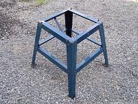 Front-side 3/4 view of the Mastercraft metal tool stand on gravel surface.