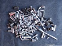 Photo showing a pile of assorted sockets in various sizes and some with rust