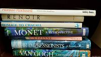 Shelf with tall hardcover art books by Norman Rockwell, Renoir, Chagall, Monet, Cezanne, Impressionists, Van Gogh