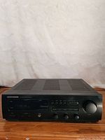 Front view of the Marantz SR-38 RDS stereo receiver showing the digital display, control knobs, buttons, and headphone jack on the front panel