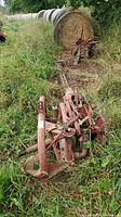 Overall view of mower frame and flail blades in grass