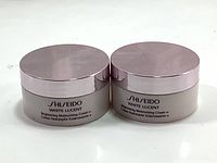 Two unopened jars of Shiseido White Lucent Brightening Moisturizing Cream shown side by side, displaying the product labeling and packaging.