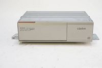 Front view of the Clarion DCZ625 6-disc CD changer with closed disc tray and visible branding.