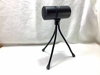 Front and side view of Thronmax M8 Pulse microphone on tripod stand showing overall condition and design.