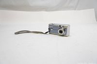 Blue Canon PowerShot A400 camera with wrist strap, shown on white background.