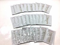 Multiple sachets of Shiseido IBUKI Gentle Cleanser laid out flat to show quantity and packaging.