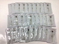 Thirty sealed 1ml sachets of Shiseido IBUKI Refining Moisturizer arranged for display.