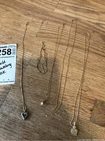 All five pieces laid out on wood surface