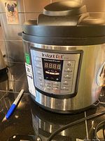 Front view of Instant Pot showing brand logo and general appearance.