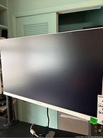 Front view of the 22 inch Samsung computer monitor with a white frame and black screen.