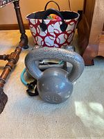 35lb kettlebell and basket containing ball and accessories