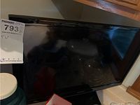 Front view of Samsung 24 inch TV showing the screen and brand label with a MaxSold tag.