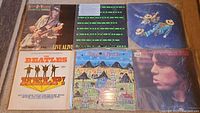 Six LPs including Stevie Ray Vaughan, Kraftwerk, Beatles, Talking Heads, Mick Jagger