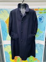 Front full view of Steinbock Luxus Himalaya Loden men's large coat on a mannequin, showing collar, button closure, and pockets.