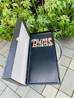 Top view of the box set opened, showing the black CD case with The Byrds logo inside.