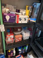 Close up of incandescent and LED light bulbs boxes, including Sunbeam and Givrée brands