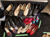 Wide angle shot showing all 12 pairs of casual women's shoes in various colors and styles.