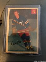 Front image of the 1954-55 Parkhurst Camille Henry hockey card showing player photo and card number 73.