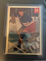 Front view of the 1954-55 Parkhurst Dean Prentice hockey card showing player in Rangers uniform, card number 74.