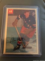 Front side of the 1954-55 Parkhurst Don Raleigh hockey card showing Don Raleigh skating in uniform, card number 68, and a facsimile signature.