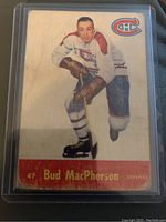 Front image of 1955-56 Parkhurst Bud MacPherson hockey card showing player in Canadiens uniform, card number and name.
