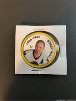 Front side of Bobby Hull hockey coin showing image, name, and season (1966-1967).