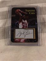 Front view of the Michael Jordan Supreme Cuts basketball card showing Jordan dunking with facsimile autograph panel.